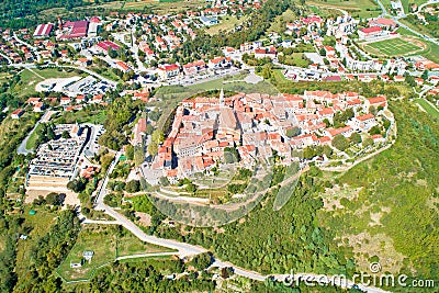 Buzet. Hill town of Buzet surrounded by stone walls in green landscape aerial view Stock Photo