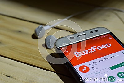 BuzzFeed: News, Tasty Quizzes application on Smartphone screen. Editorial Stock Photo