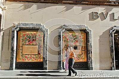 Bvlgari or Bulgari Store Logo and Showcase Windows in Rome, Italy with people Editorial Stock Photo