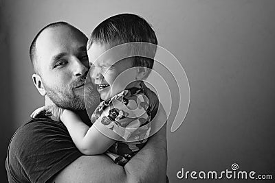 BW portrait of father playing with his daughter. Stock Photo