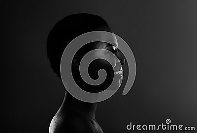 Bw Profile Portrait Of Smiling Black Woman In Backlit Over Dark Background Stock Photo