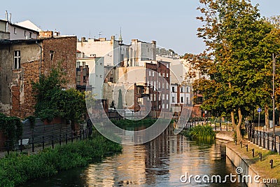 Bydgoszcz. Old buildings on the Brda River in the morning sun. A place called Bydgoszcz Venice Stock Photo