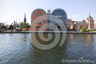 Modern buildings, the seat of the bank and the historic Lloyd Palace on the Brda River, Bydgoszcz, Poland Editorial Stock Photo