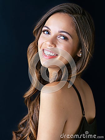 Bye bye pimples, hello gorgeous skin. Portrait of a beautiful young woman posing against a dark background. Stock Photo