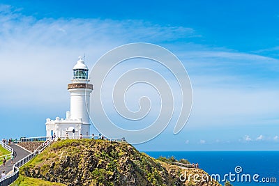 Ocean view over Cape Byron lighthouse, the Most Easterly Point on the Australian Mainland with green turquoise water waves in Byro Editorial Stock Photo