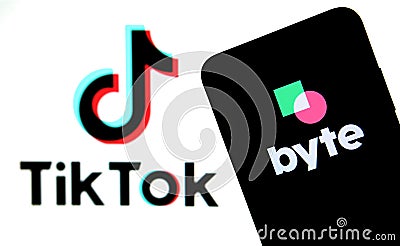 Byte app on the silhouette of smartphone and TikTok logo on a blurred background screen. Byte is the sequel to Vine app. Real phot Editorial Stock Photo