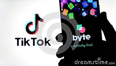 Byte app on the silhouette of smartphone and TikTok logo on a blurred background screen. Byte is the sequel to Vine app. Real phot Editorial Stock Photo