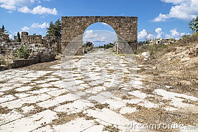Byzantine road with triumph arch in ruins of Tyre, Lebanon Stock Photo