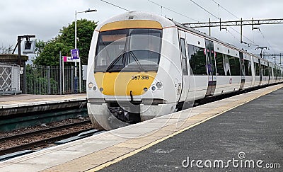 C2C train arriving at Benfleet Station in Essex Editorial Stock Photo