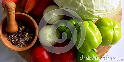 Cabbage, onions, bell peppers, carrots, tomatoes, spices. Stock Photo