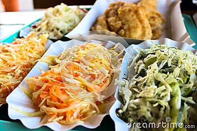 Cabbage salad and pieces of roasted fish Stock Photo