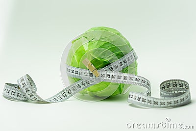 cabbage tied with measuring tape. Stock Photo