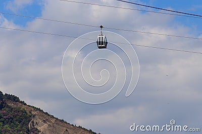 Cabin of cable car against blue sky. Cableway in Tbilisi, Georgia Stock Photo