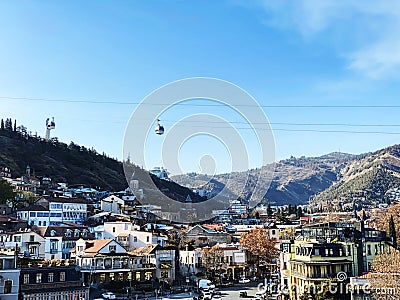 Cabin of the cable car against blue sky. Cableway in Tbilisi, Georgia Editorial Stock Photo