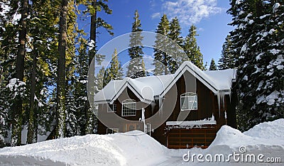 Cabin covered by fresh snow Stock Photo