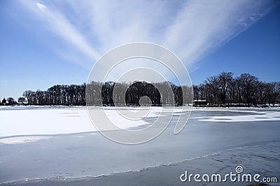 Cabin on frozen lake Stock Photo