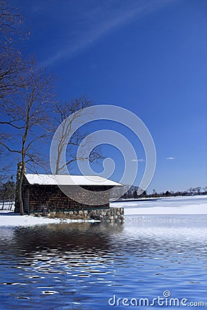 Cabin on frozen lake Stock Photo