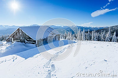 Cabin in the mountains in winter Stock Photo