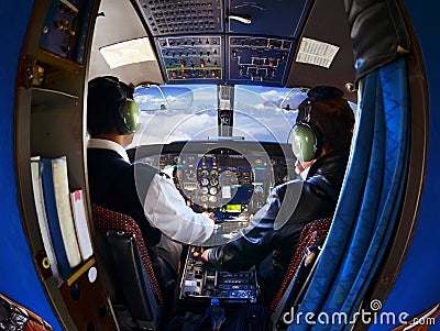 The cabin of the old passenger plane with pilots Editorial Stock Photo