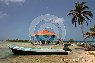 Cabins on stilts on the small island of Tobacco Caye, Belize Stock Photo