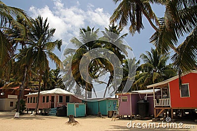 Cabins on stilts on the small island of Tobacco Caye, Belize Stock Photo