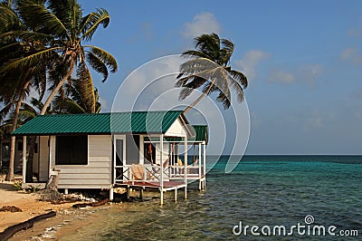 Cabins on stilts on the small island of Tobacco Caye, Belize Stock Photo