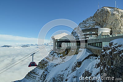 Cable car full of tourists approaching top station on Mount Pilatus in Swiss Alps Editorial Stock Photo