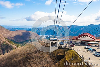 Cable car or ropeway and tourist is moving up to the top of the mountain at Akechidaira plateau in winter. Editorial Stock Photo