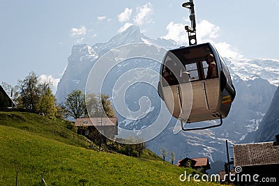 Cable car swinging on its cable in Grindelwald, Switzerland. Stock Photo