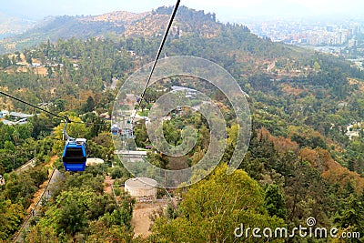 Cable Cars of Cerro San Cristobal Hill among Fall Foliage, Santiago, Chile Stock Photo