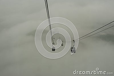 Cable cars traveled in the fog. Stock Photo