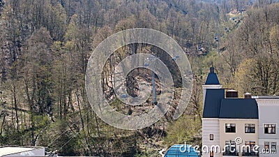 Cable chair ski lift in Gorky Gorod mountain ski resort in Caucasus mountains on Krasnaya Polyana, Sochi, Russia. Scenic Editorial Stock Photo