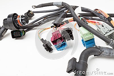 A cable of matted wires of different colors with connectors in the electrical wiring of the car. Internet line in the work of the Stock Photo