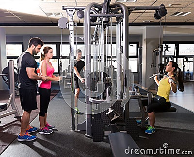 Cable pulley system gym workout fitness people Stock Photo