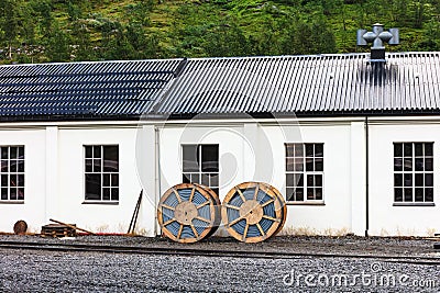 Cable reels at the white railway station Stock Photo