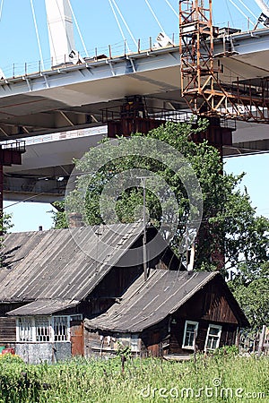 Cable-stayed bridge under construction over residential house Editorial Stock Photo