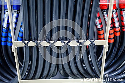 Cable tray with electrical wiring arranged on ceiling ,Cable tray epoxy dark grey : Houses runs of control and power cable used f Stock Photo