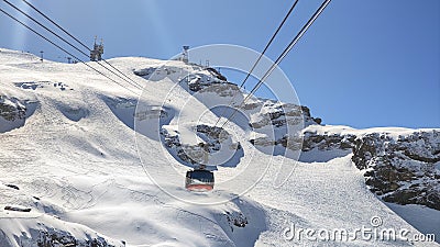 The cableway to mount Titlis over Engelberg on the Swiss alps Editorial Stock Photo