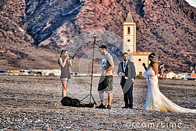 Photographer doing photo session for a wedding in Cabo de Gata, Almeria Editorial Stock Photo