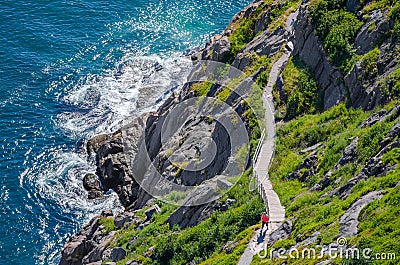 Cabot Trail with hikers staying in shape, walking along in St John's, Newfoundland. Editorial Stock Photo