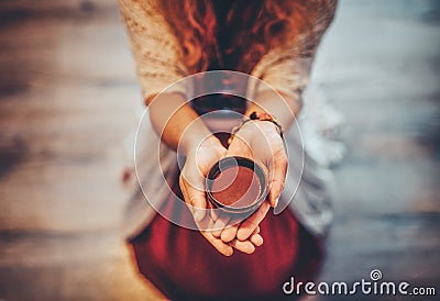 Cacao ceremony, heart opening medicine. Ceremony space. Cacao cup in woman& x27;s hand. Stock Photo