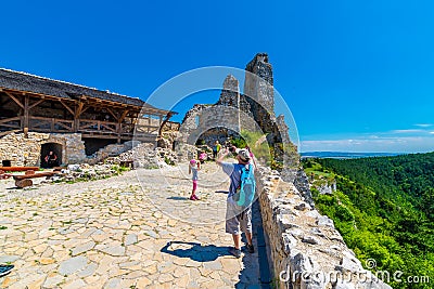 Cachtice, Slovakia - 4.7.2020: Tourists are visiting ruin of medieval castle Cachtice. Famous castle known from legend about blood Editorial Stock Photo