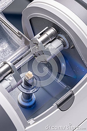 CAD CAM dental computer-aided machine. Digital modern dental laboratory for prosthesis and crowns milling Stock Photo