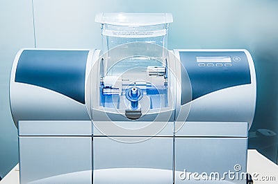 CAD CAM dental computer-aided machine in a highly modern dental laboratory for prosthesis and crowns milling. Dentistry, prostodon Stock Photo