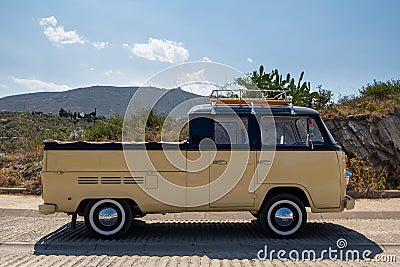 Cadaques, Spain, 01/08/2016 classic yellow and white Volkswagen pickup with roof racks Editorial Stock Photo