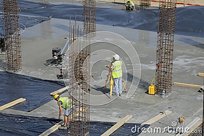 Cadastral engineer conducting land management expertise on a con Editorial Stock Photo