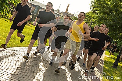 Cadets of the Academy of the National Guard of Ukraine running in the park, group of people training outdoors, Kharkov, Ukraine, 3 Editorial Stock Photo