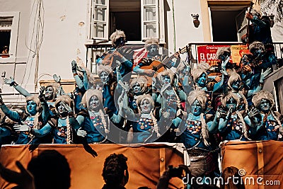 CADIZ/SPAIN-March:Cheerful local carnival chorus chirigota sings presenting prepared songs in the streets during the Carnaval of Editorial Stock Photo