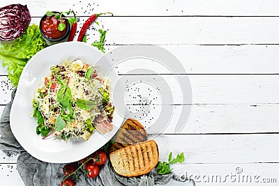 Caesar salad with bacon. Food. Top view. Stock Photo