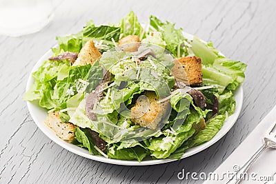 Caesar Salad with Croutons, Parmesan and Anchovies Stock Photo